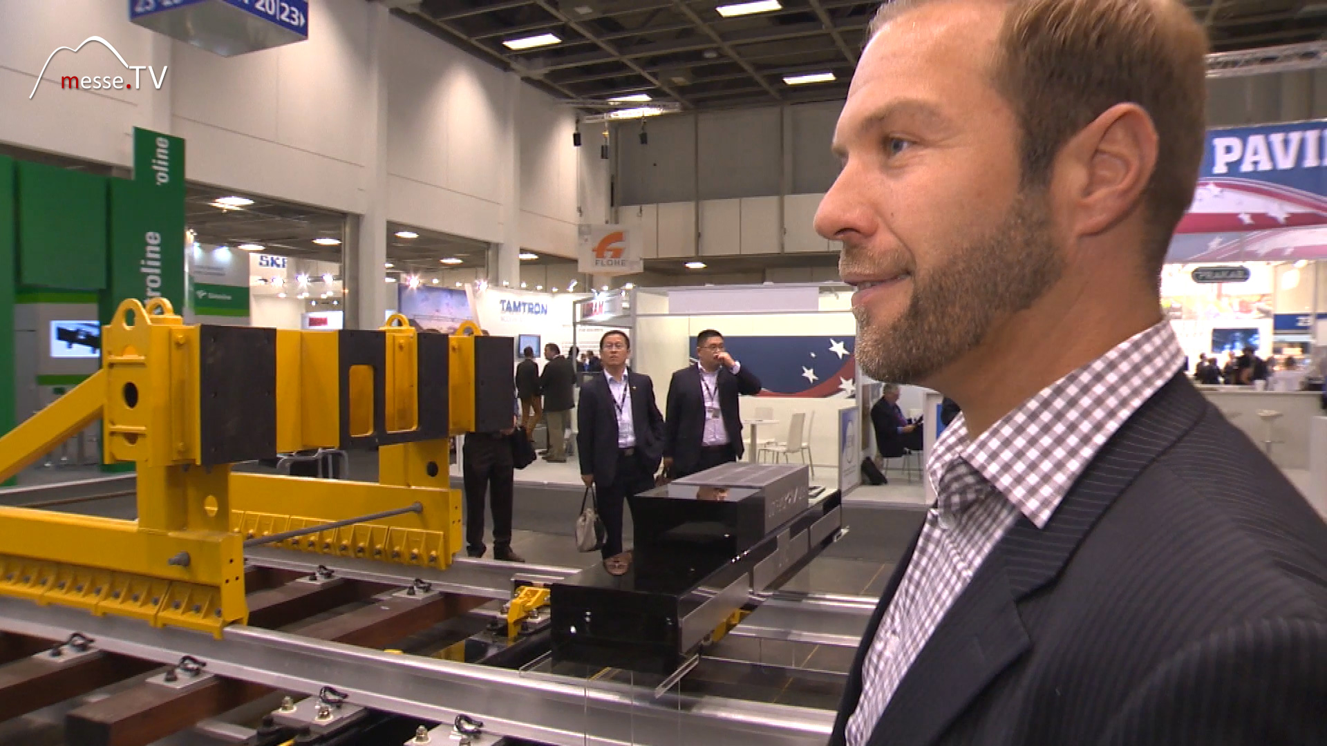 MesseTV Berichterstattung Moderator Juergen Groh innotrans Berlin Progress Rail Caterpillar