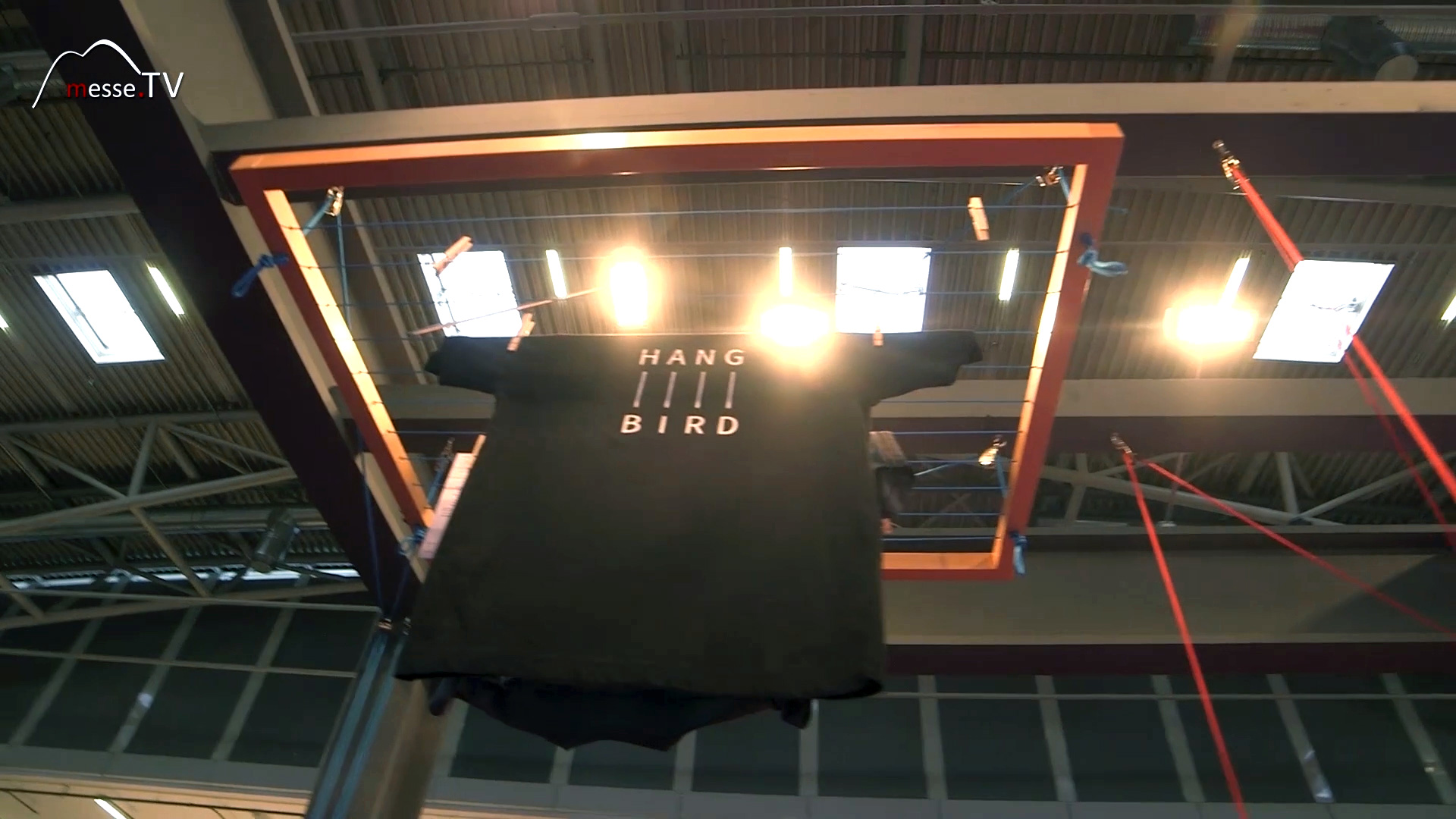 Clothes dryer hangs from the ceiling Hangbird