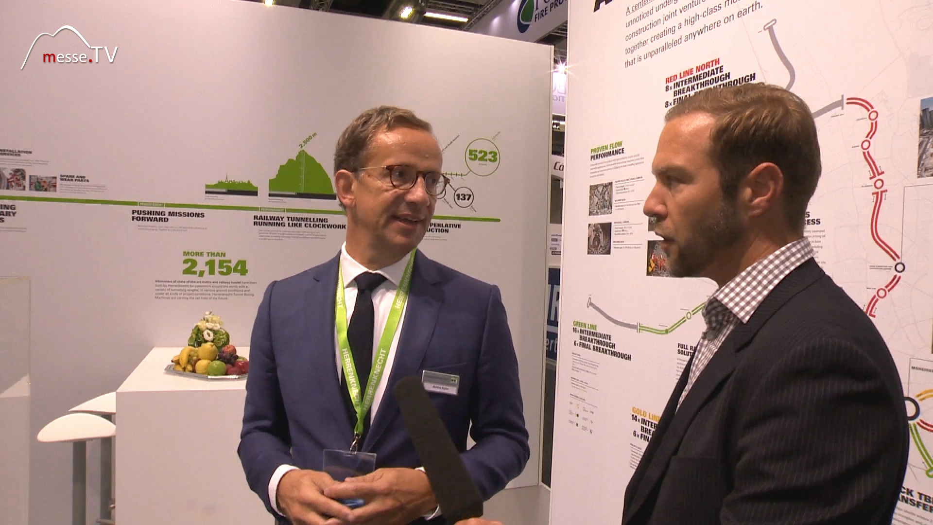 MesseTV interview moderator Juergen Groh with Achim Kuehn Herrenknecht Tunnelbau