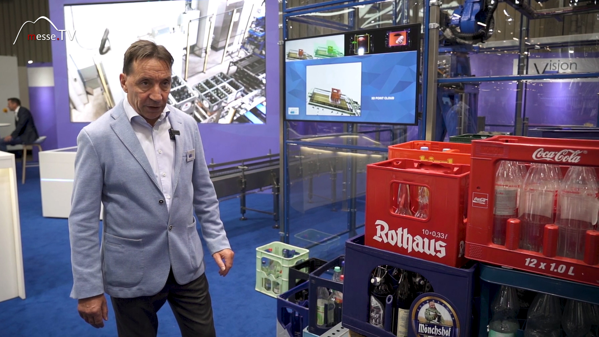 Knut Oppermann shows articulated arm robot beverage industry BrauBeviale 2023