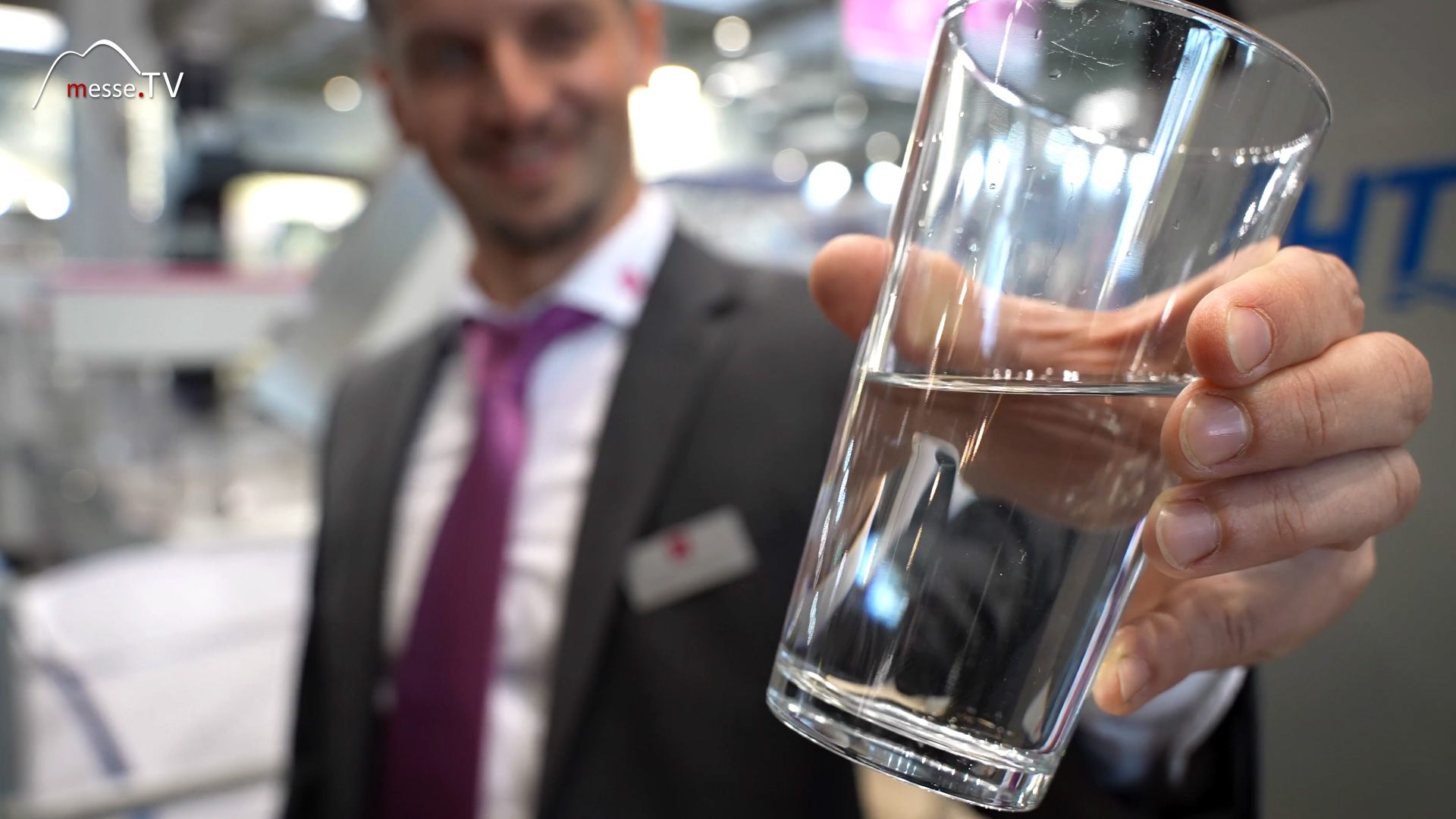 glass with clean water after filtration water jet cutting system perndorfer euroblech 2024