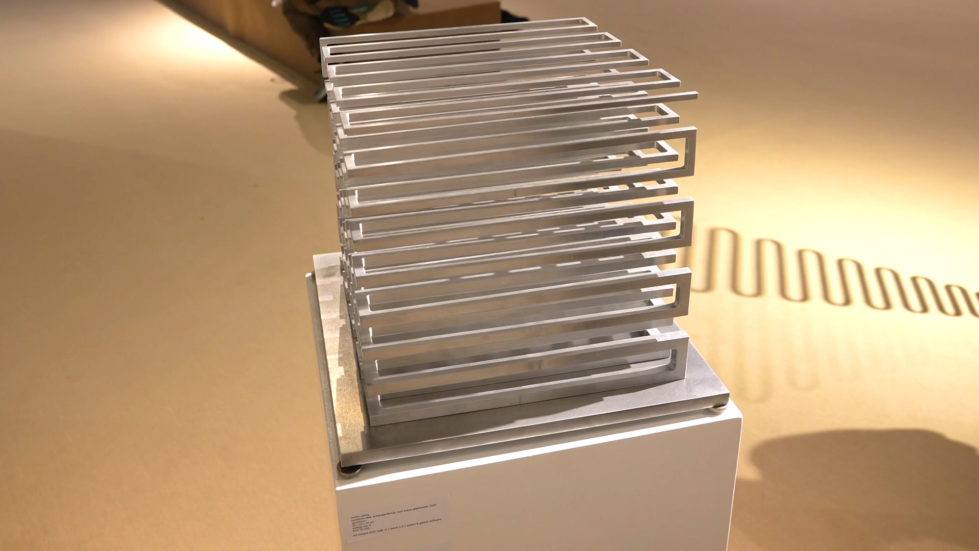 Artwork snake shaped conical rod cube