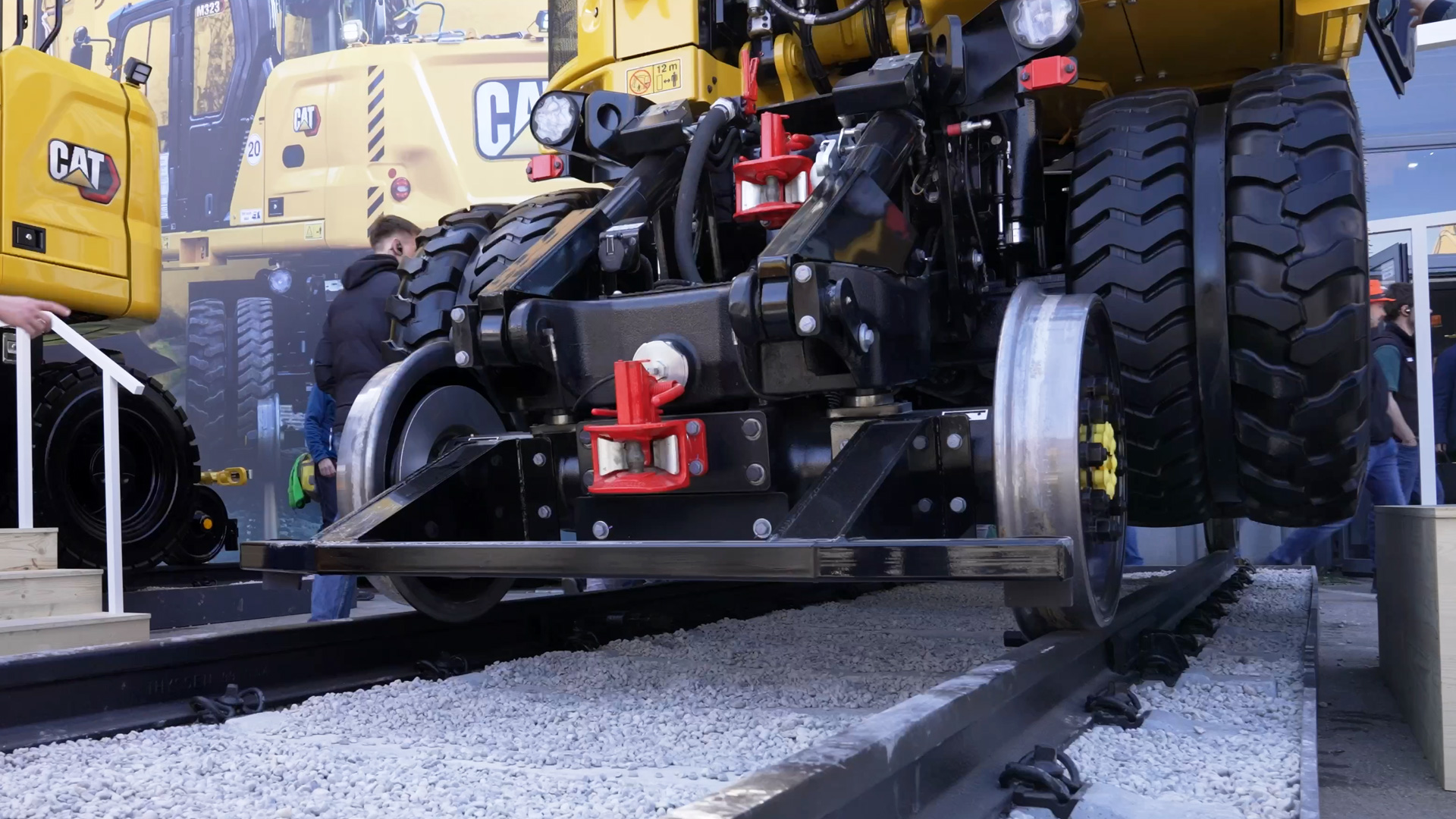 cat rail road excavator can be driven using rubber tires and railway tires