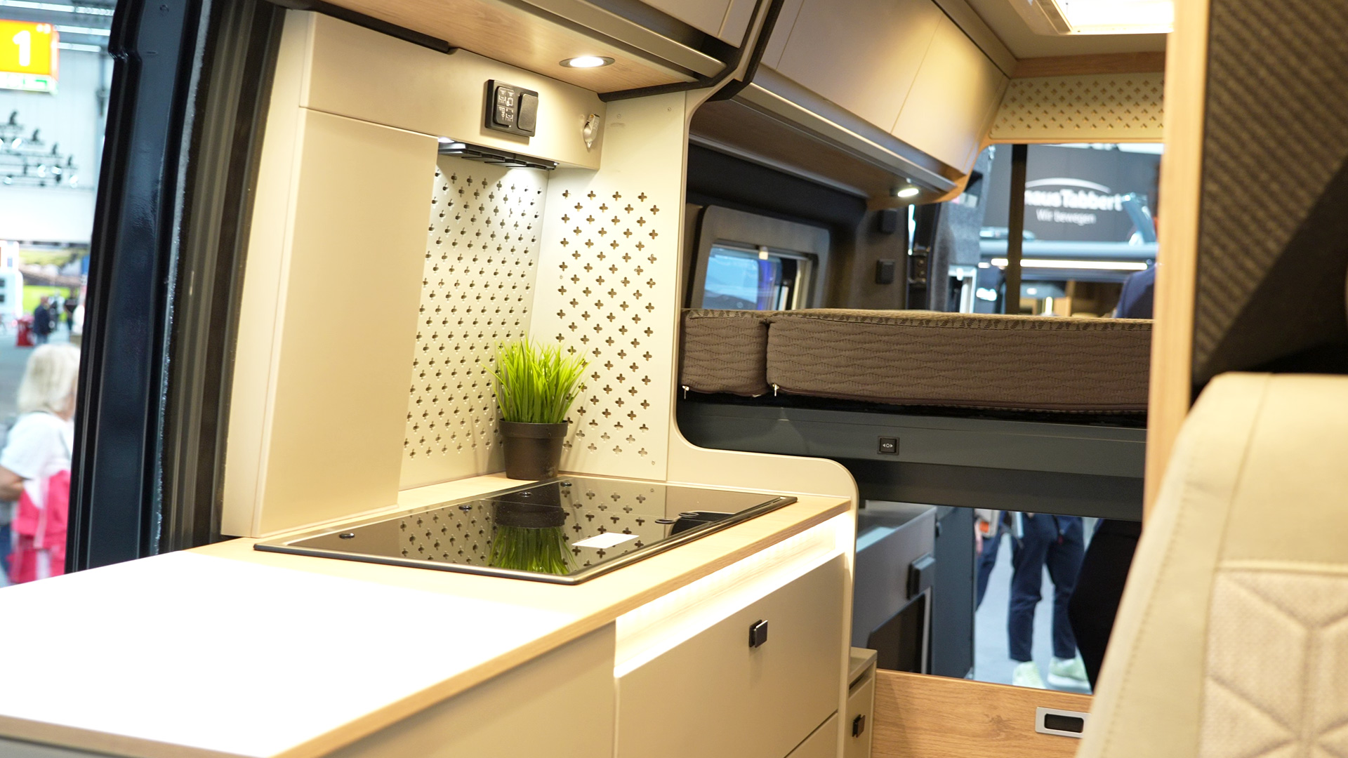 Campervan interior with ceiling cupboards and kitchen