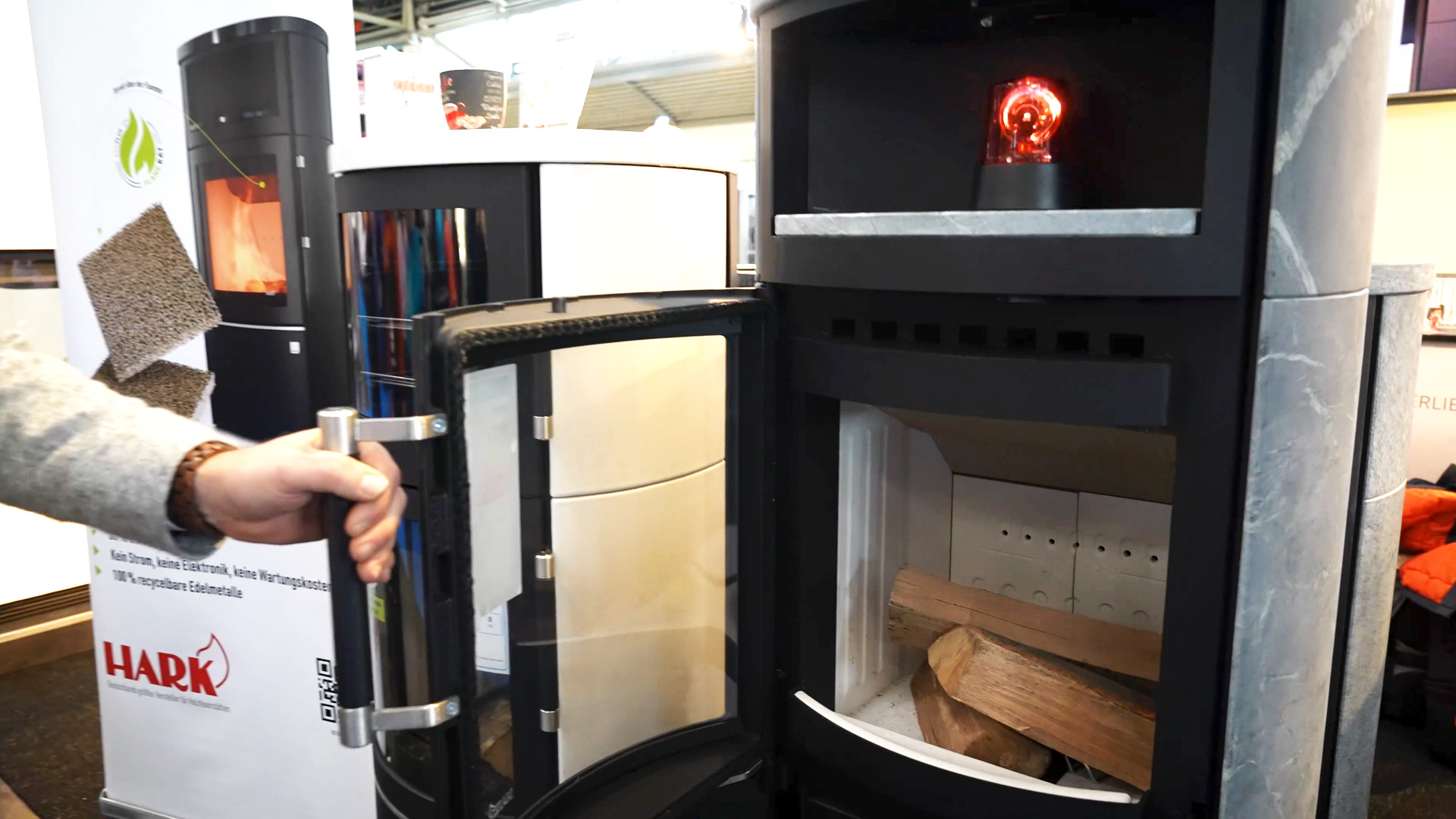 Wood burning stove with viewing window combustion chamber