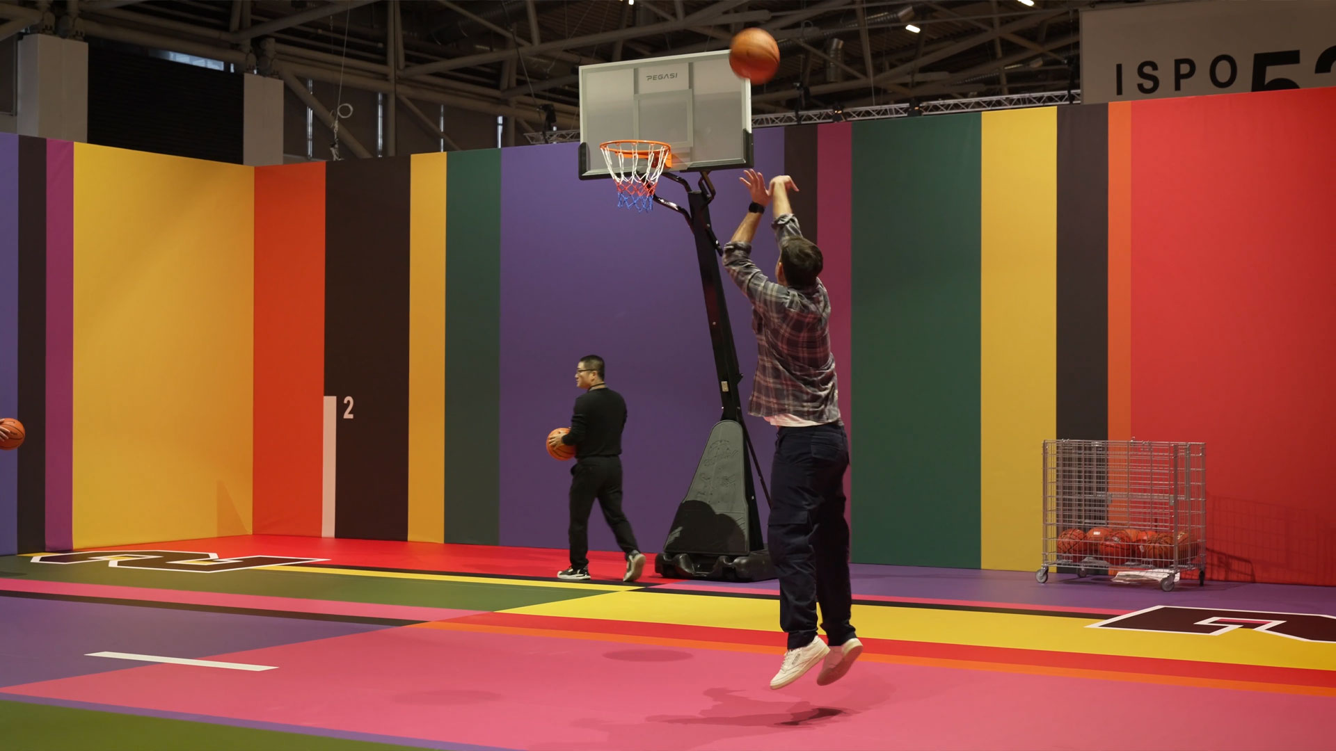 People play basketball at the ISPO Munich sports and outdoor trade fair