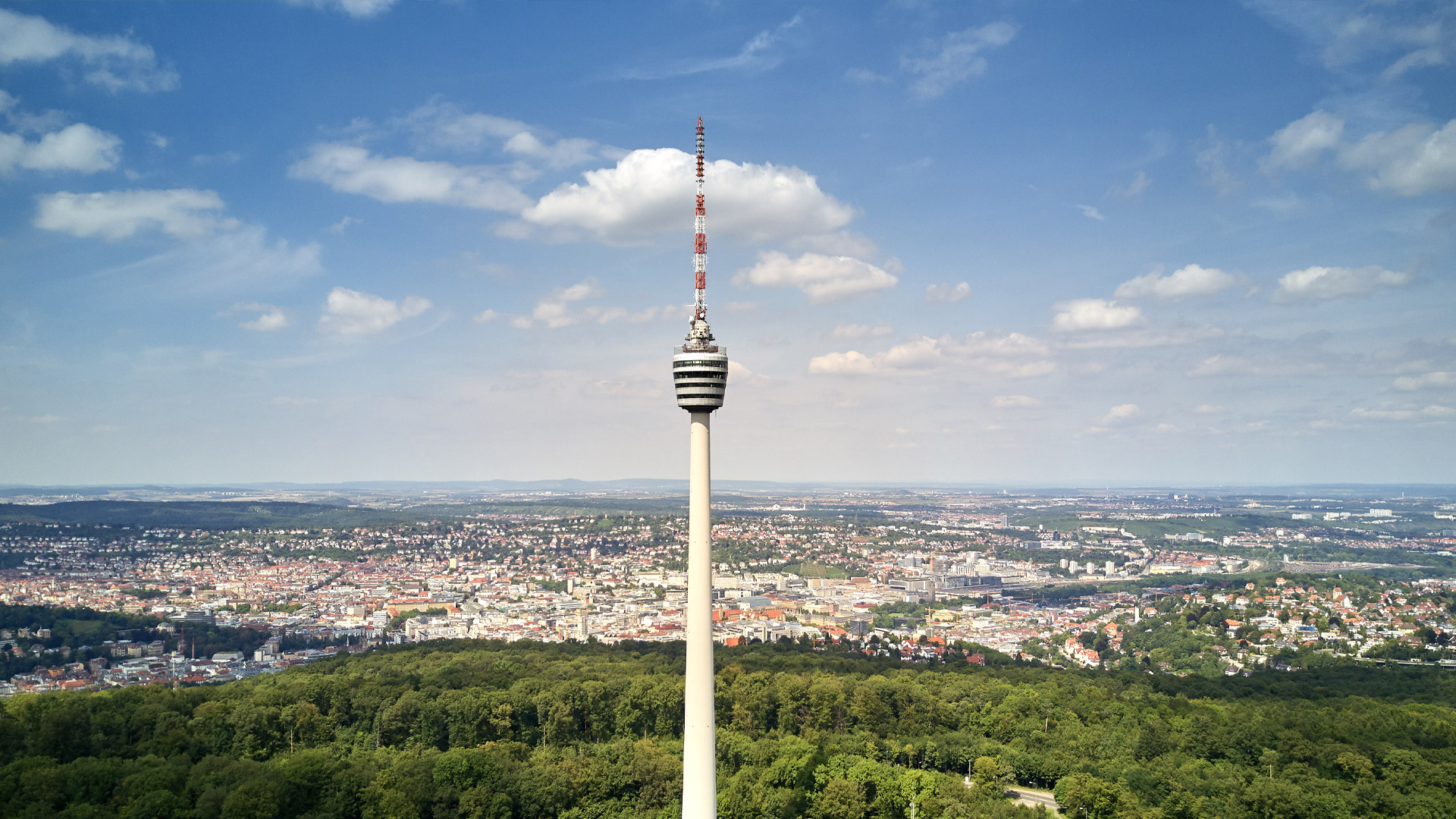 View from the Stuttgart TV tower over the city and the green surrounding area – sights not far from the Stuttgart Exhibition Center.