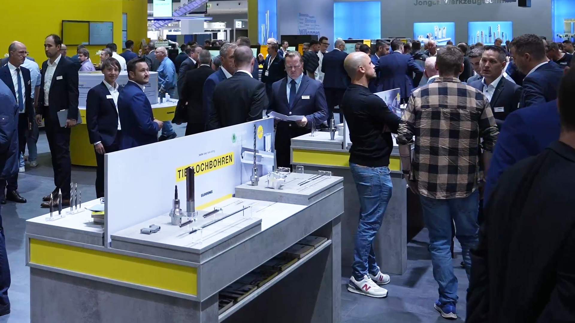 View of the Stuttgart exhibition grounds with numerous visitors in the exhibition halls during a large trade fair.